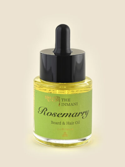 Rosemary Skæg- & Hårolie fra THE INMANI – naturlig olie med rosmarin og argan, vist i bæredygtig glasflaske.